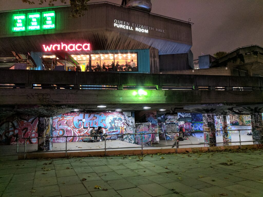 This picture truly captures London - Royalty on top, poor people almost 'hidden' on the bottom. Queen Elizabeth Hall, London.