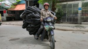 Impressive motorbike driver delivering tires.