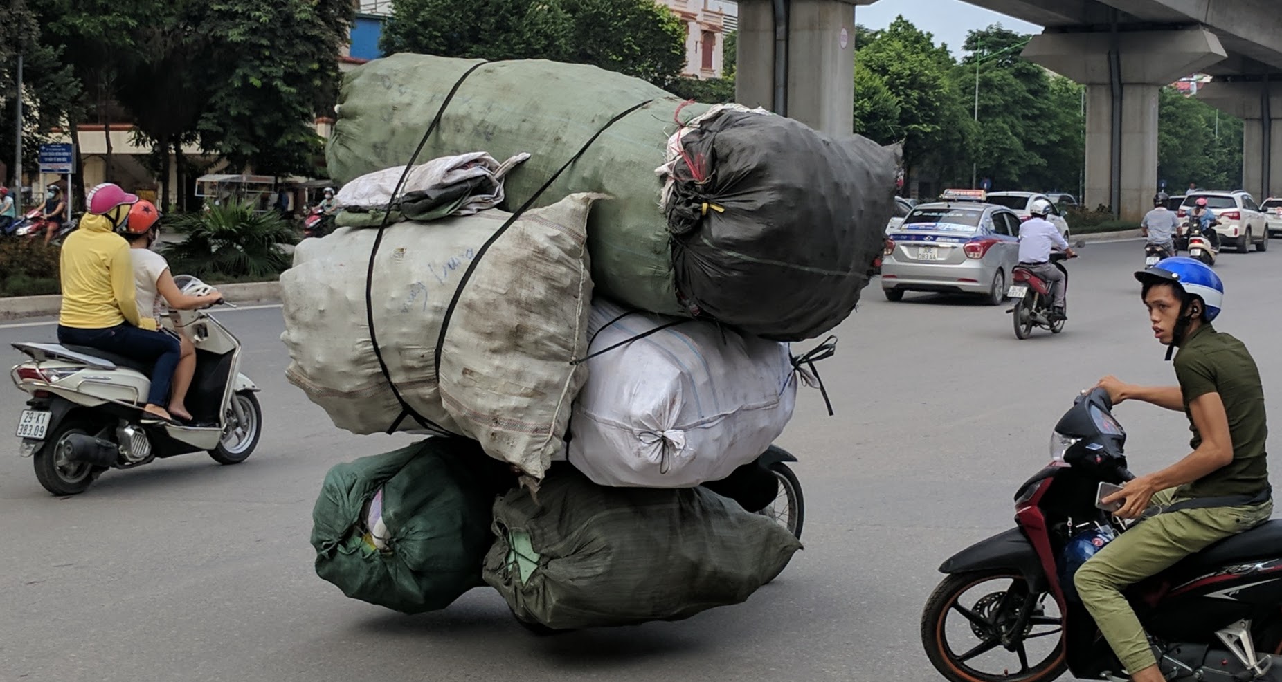 Talented motorbike driver delivering a massive, impressive load!