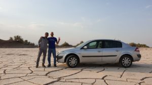 In the Shahdad Desert, Soroush and I stopped to take a picture with his car | Scenes from our Iran road trip | VincePerfetto.com
