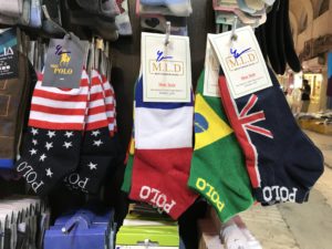 The same vendor who was selling the baby socks was also selling these socks. From left to right: adult socks with the flags of the United States, France, Brazil, and Britain. Pictures of the American flag inside Iran - and United States military merchandise, too! | VincePerfetto.com
